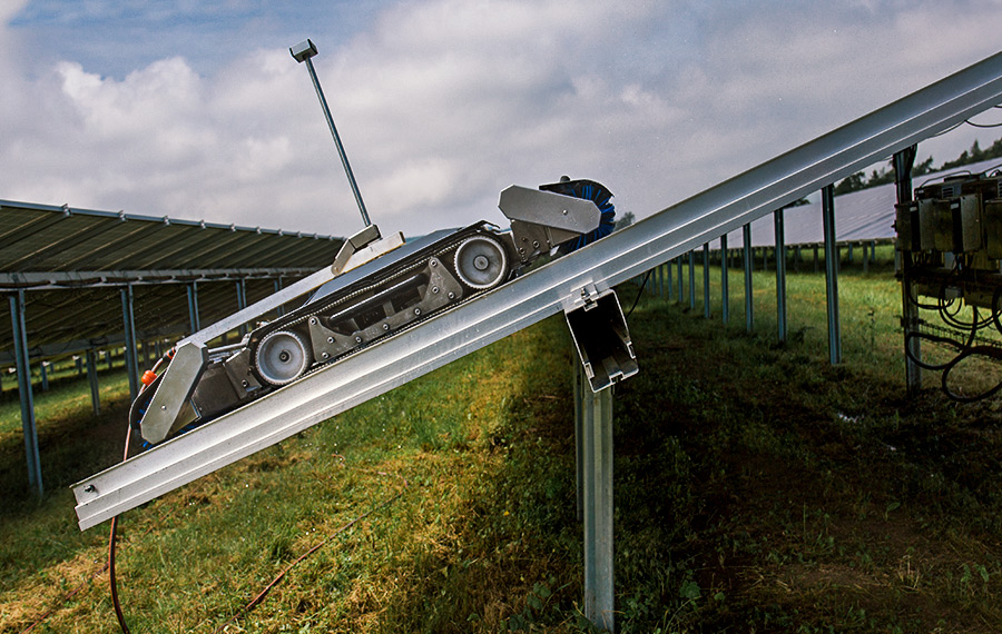 Solar robot climbing slopes of solar installations
